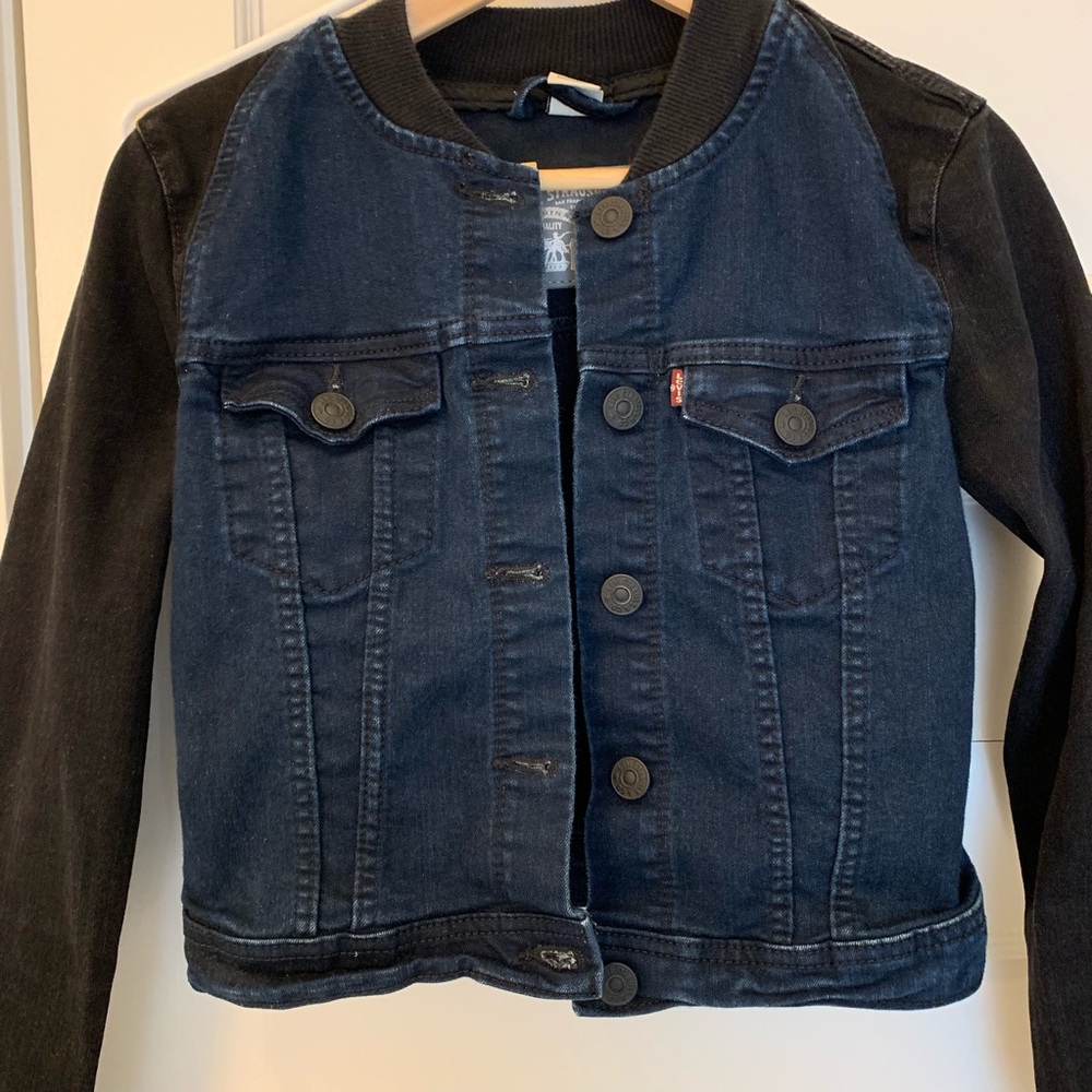 Levi’s cropped black and blue jean jacket